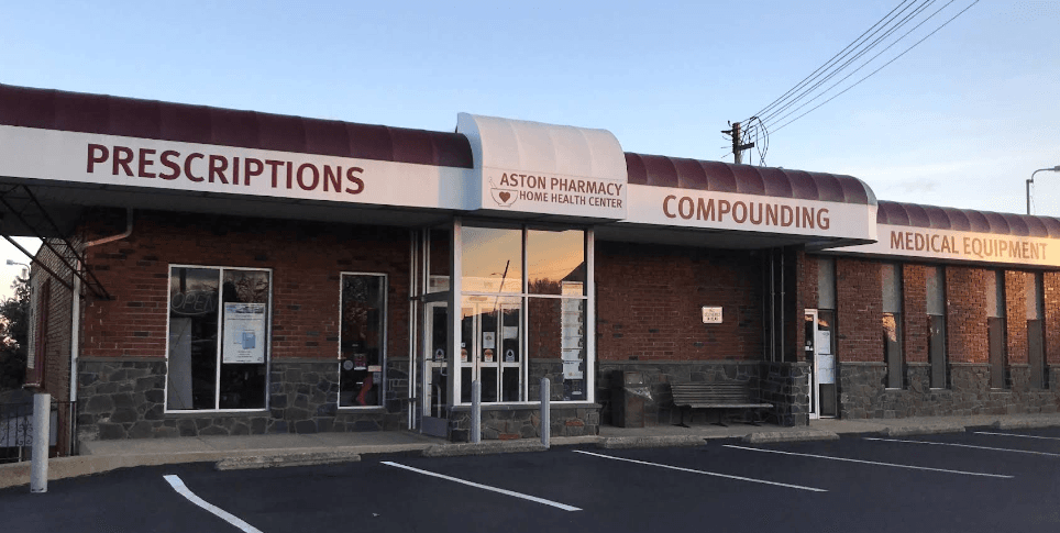 pharmacist greeting a patient inside Aston Pharmacy